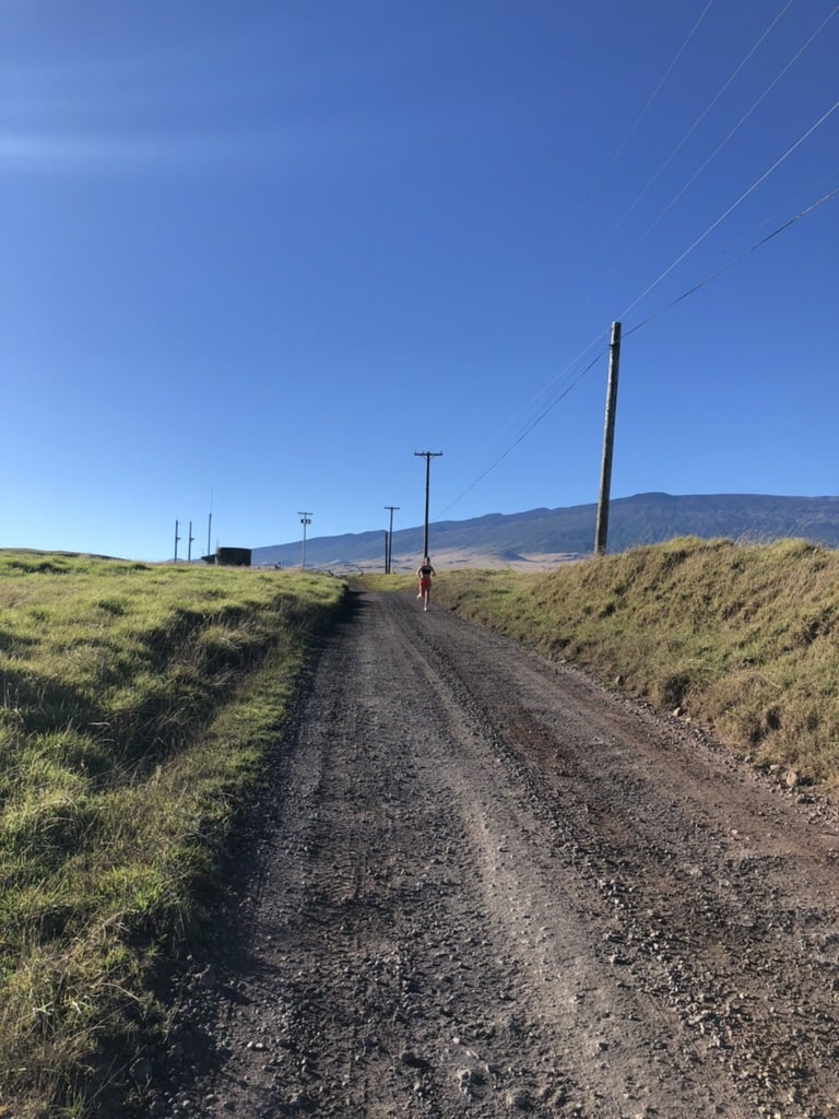 Runner on Saddle Road coming toward the camera